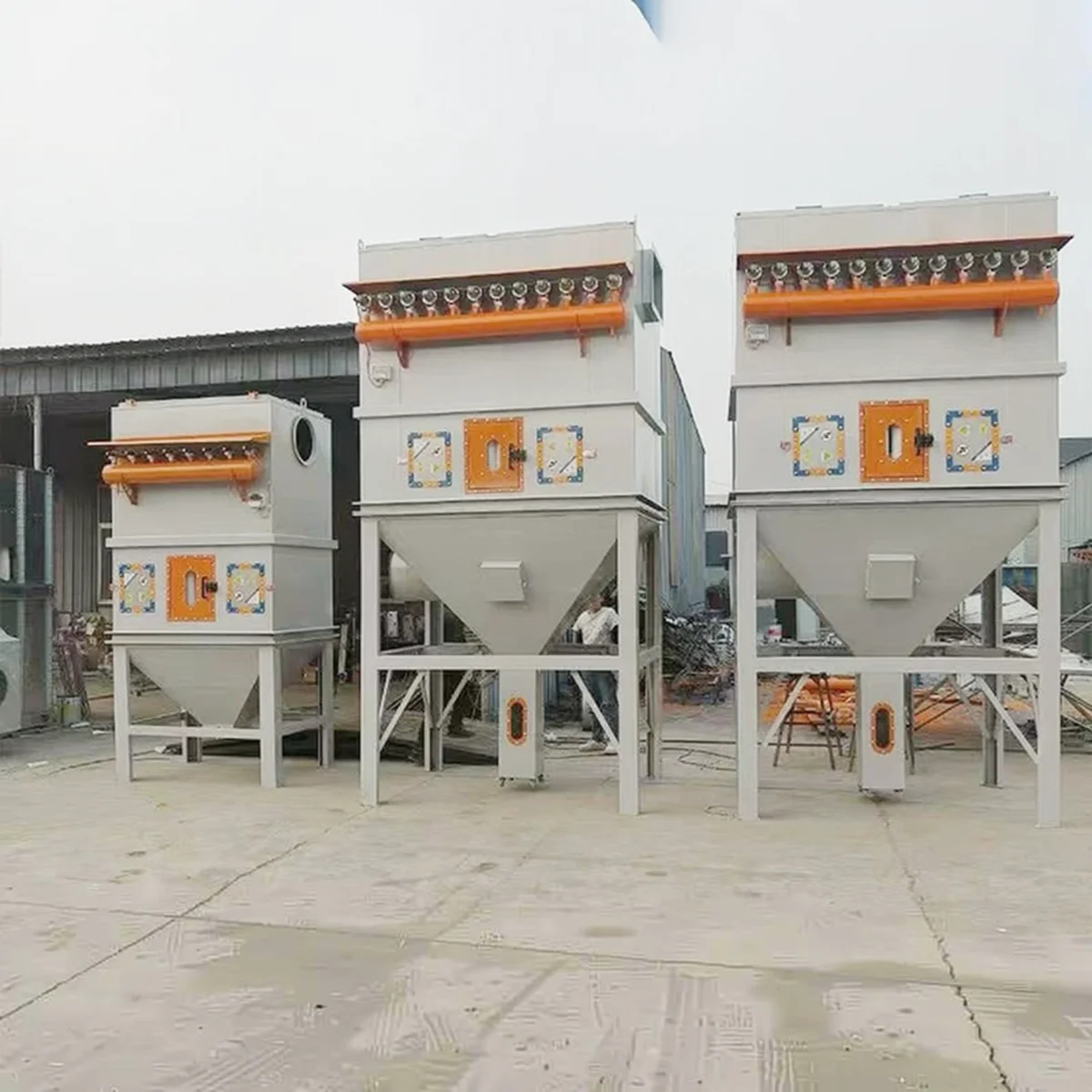 Dust collector units lined up in production workshop - view 4